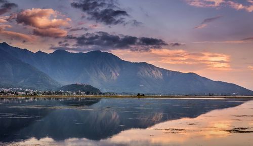 Scenic view of lake against sky during sunset