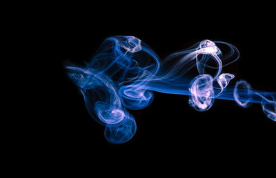Close-up of smoke against black background