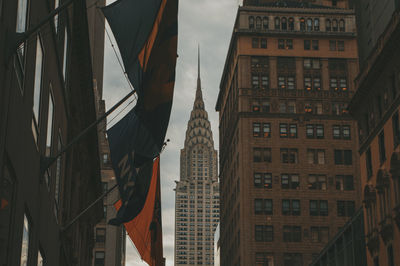 Low angle view of buildings in city against sky