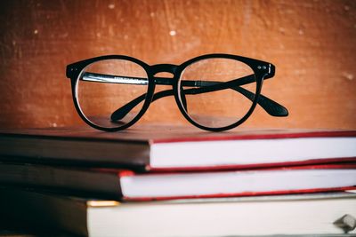 Close-up of eyeglasses on books