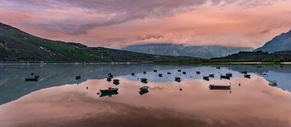 Scenic view of lake against sky during sunset