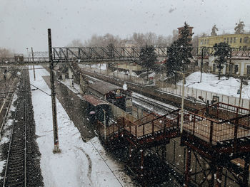 High angle view of snow covered city during rainy season