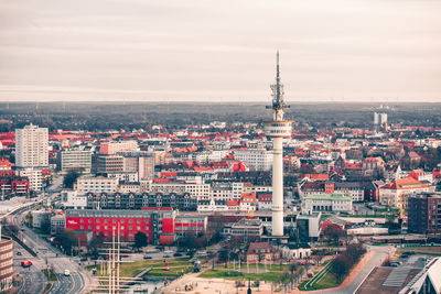 High angle view of city buildings against sky