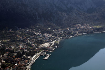 High angle view of townscape by sea