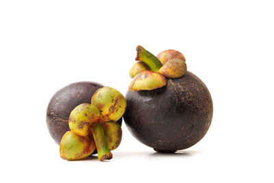 Close-up of fruits against white background