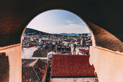 High angle view of town seen through arch