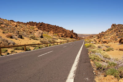 Road amidst landscape against clear sky