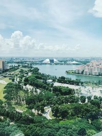 High angle view of bay and buildings against sky