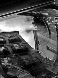 View of buildings against cloudy sky