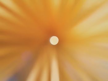 Low angle view of illuminated lights against sky at night