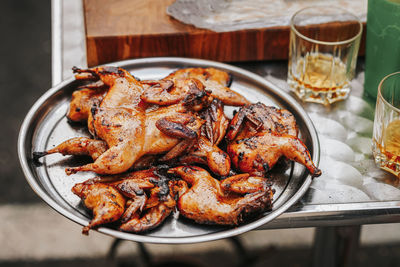 High angle view of meat on barbecue grill