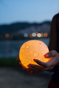 Close up moon in woman's hands. astrology concept person
