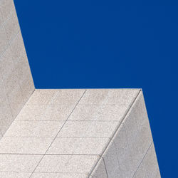 Low angle view of building against clear blue sky