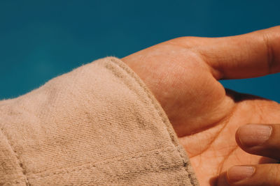 Close-up of man hand on floor