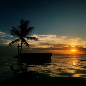 Scenic view of sea against sky at sunset