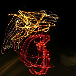 Light painting against sky at night