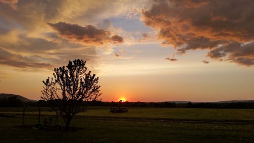 Scenic view of landscape against cloudy sky