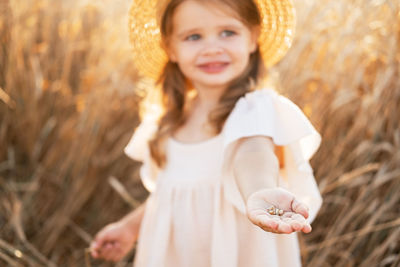 Portrait of young woman wearing hat