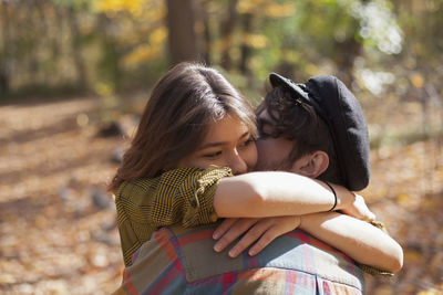 Rear view of mother and daughter outdoors