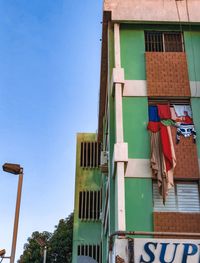 Low angle view of building against blue sky