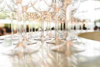 Close-up of wine glasses on table