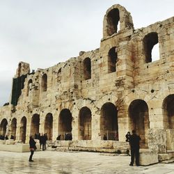 Tourists in front of historical building