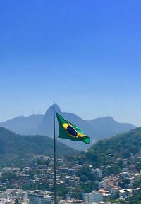 Scenic view of mountains against clear blue sky