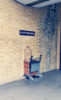Bicycle sign on brick wall