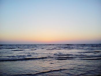 Scenic view of sea against clear sky during sunset