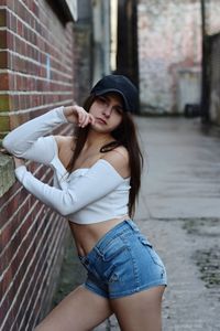 Portrait of beautiful young woman standing outdoors