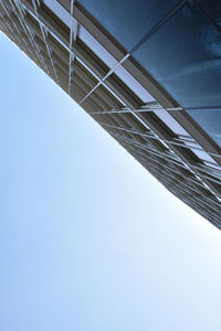 Low angle view of bridge against clear blue sky
