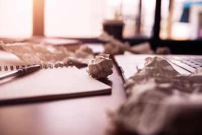 Close-up of crumpled papers on table