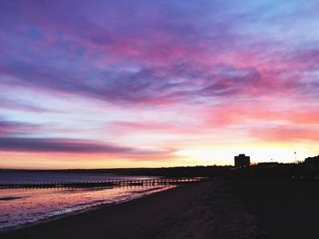 Scenic view of beach against sky during sunset