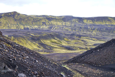 Scenic view of landscape and mountains against sky