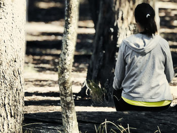 Rear view of woman standing outdoors