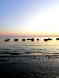 Scenic view of sea against clear sky during sunset