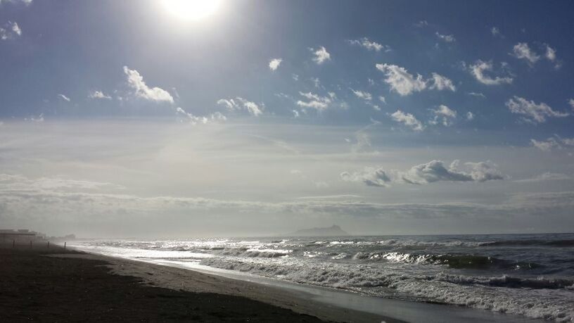 sea, beach, horizon over water, water, sky, shore, scenics, sand, beauty in nature, tranquil scene, tranquility, nature, wave, cloud - sky, sunlight, sunbeam, coastline, idyllic, sun, cloud