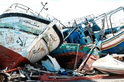 Boats moored at harbor