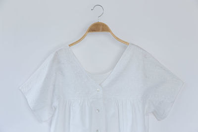 Close-up of white decoration hanging against wall