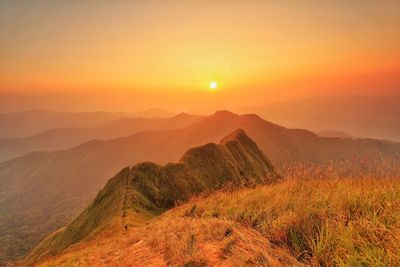 Scenic view of mountains against sky during sunset