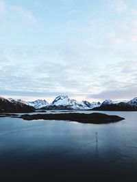 Scenic view of lake against sky during winter