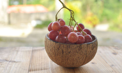 Close-up of fresh fruits in bowl on table