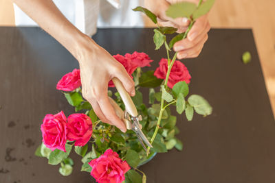 Midsection of woman holding bouquet