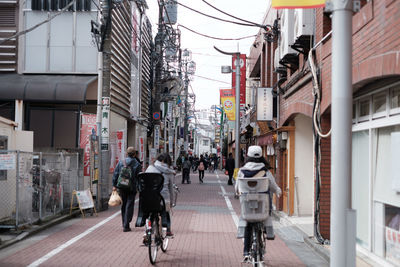 Man cycling on street in city