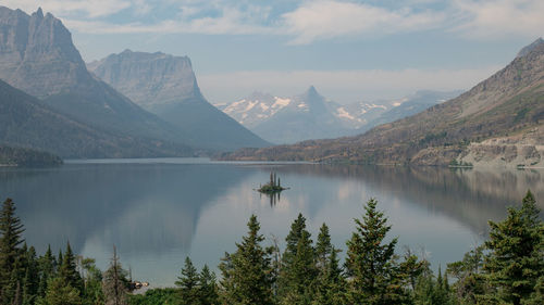 Scenic view of lake and mountains against sky