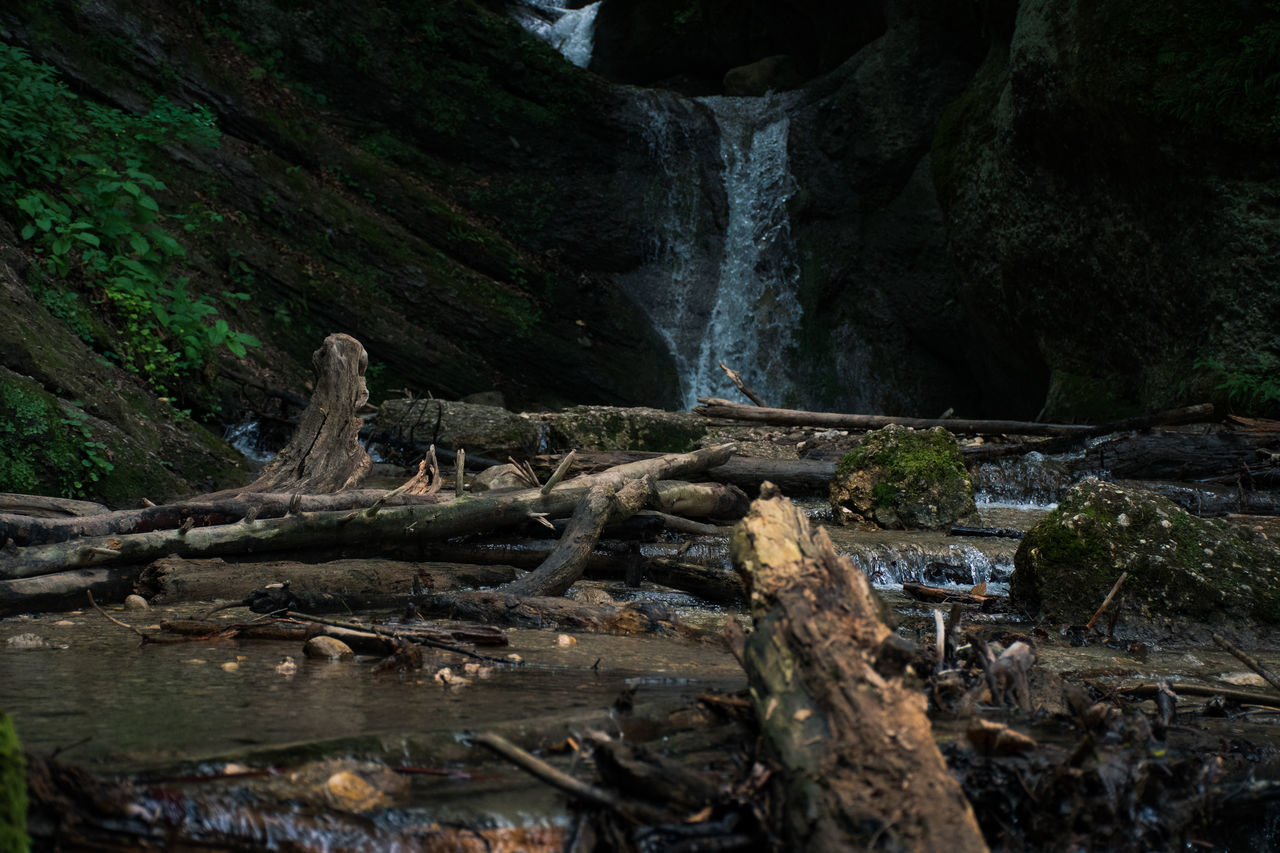 SCENIC VIEW OF WATERFALL ON ROCKS