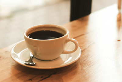 Close-up of coffee cup on table