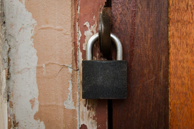 Close-up of padlock on metal door