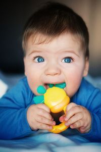 Close-up portrait of cute boy holding baby