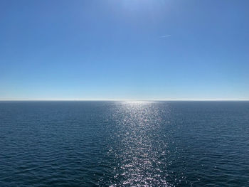 Scenic view of sea against clear blue sky